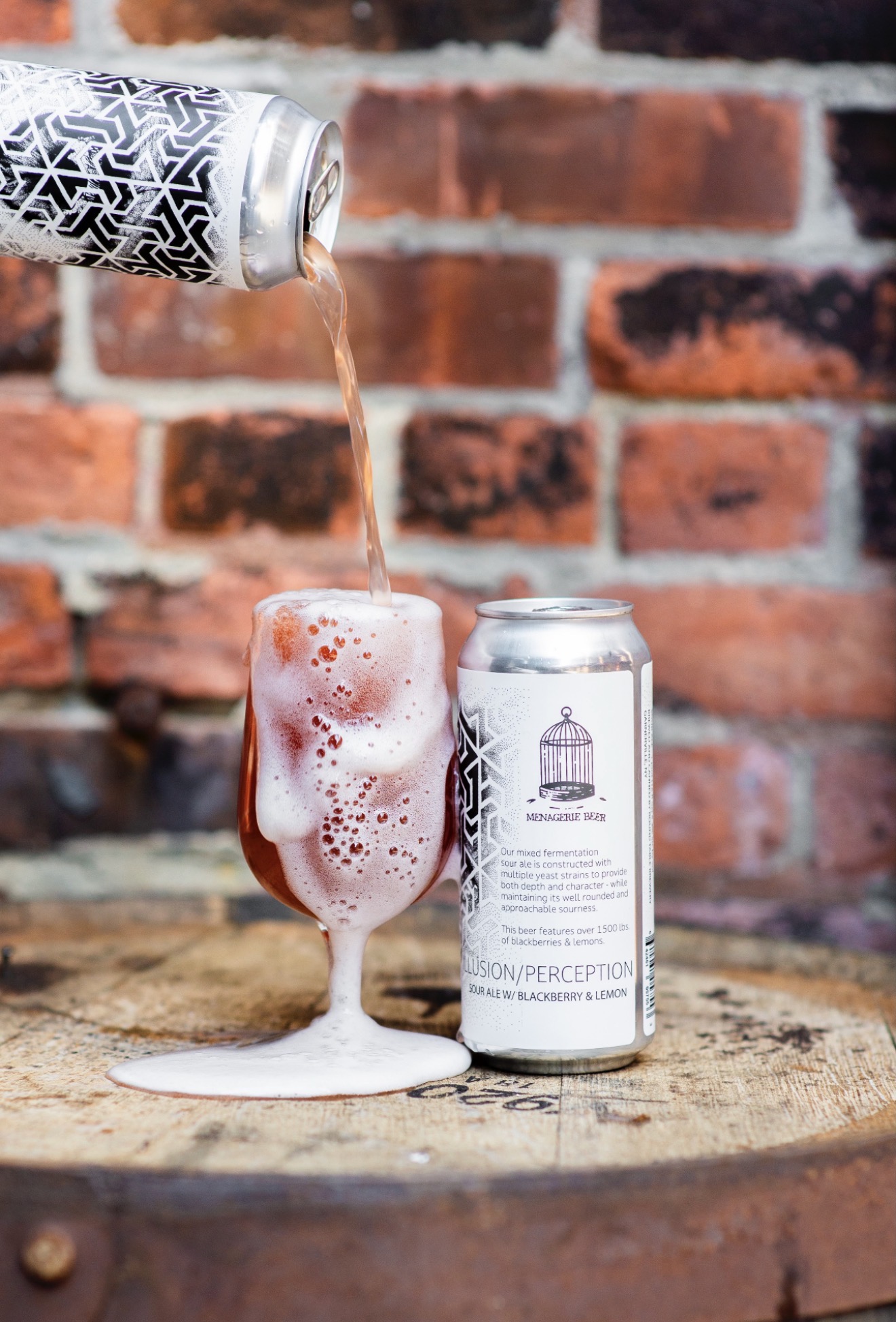 Menagerie Beer poured into a glass beside its illustrated can